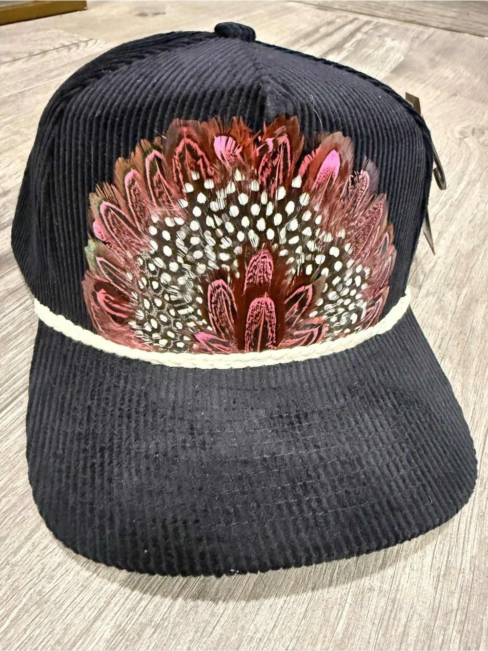 Women’s Black Corduroy Cap with Feather Embellishment